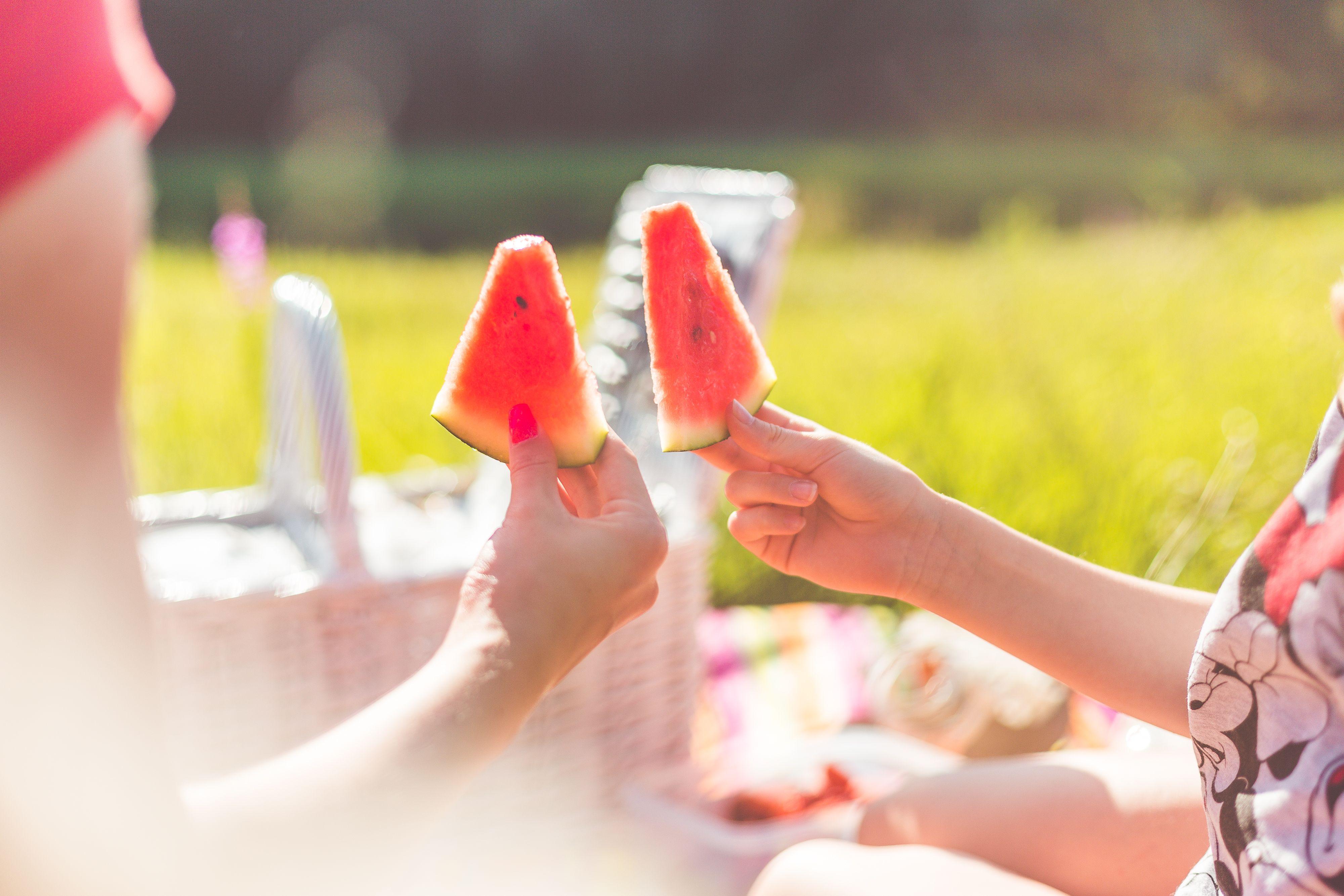 4000x2667 Woman With Child Enjoying Fresh Picnic Melon Free