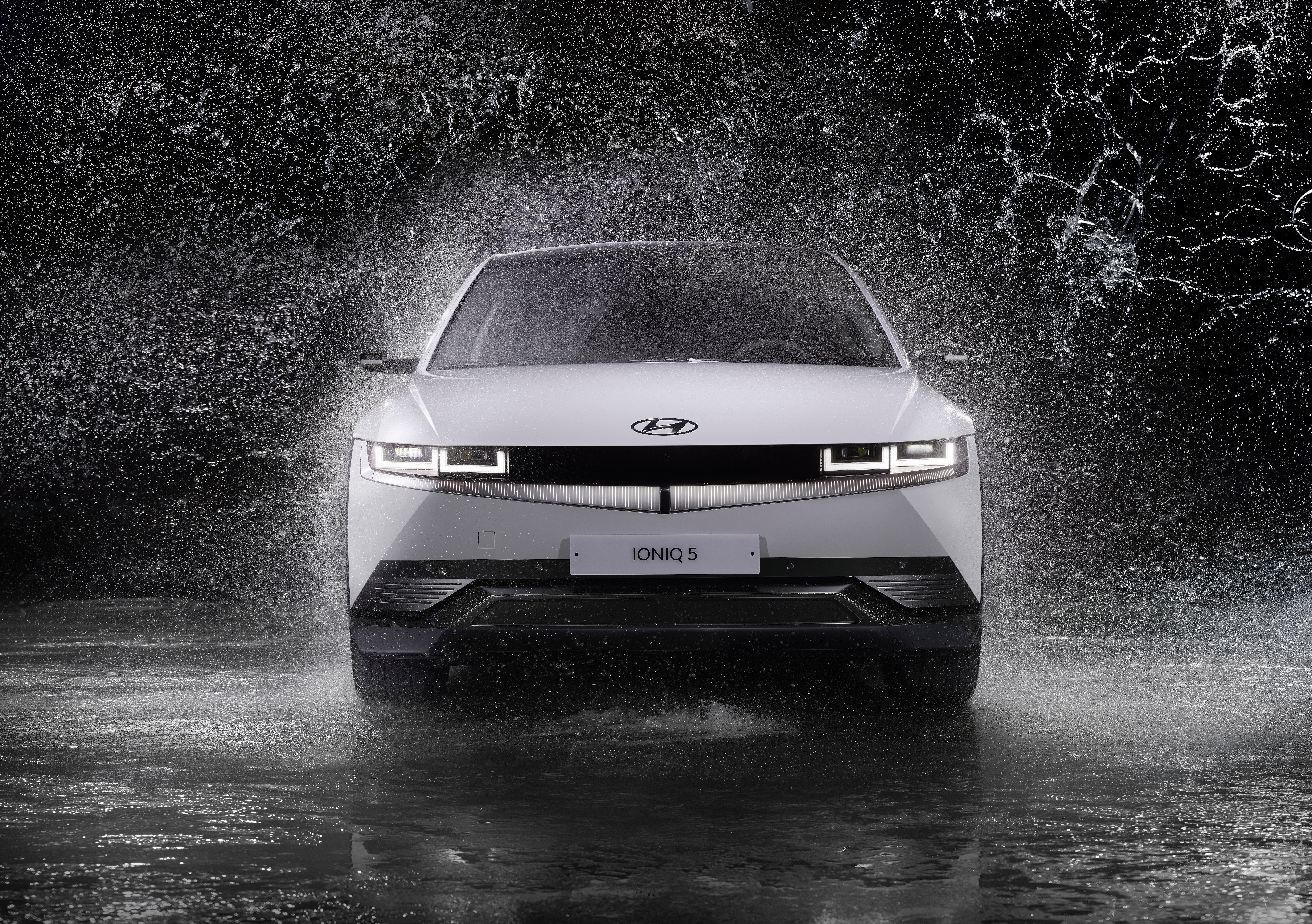 8192x5772 Grayscale Photo of a Hyundai Ioniq 5 in the Rain · Free