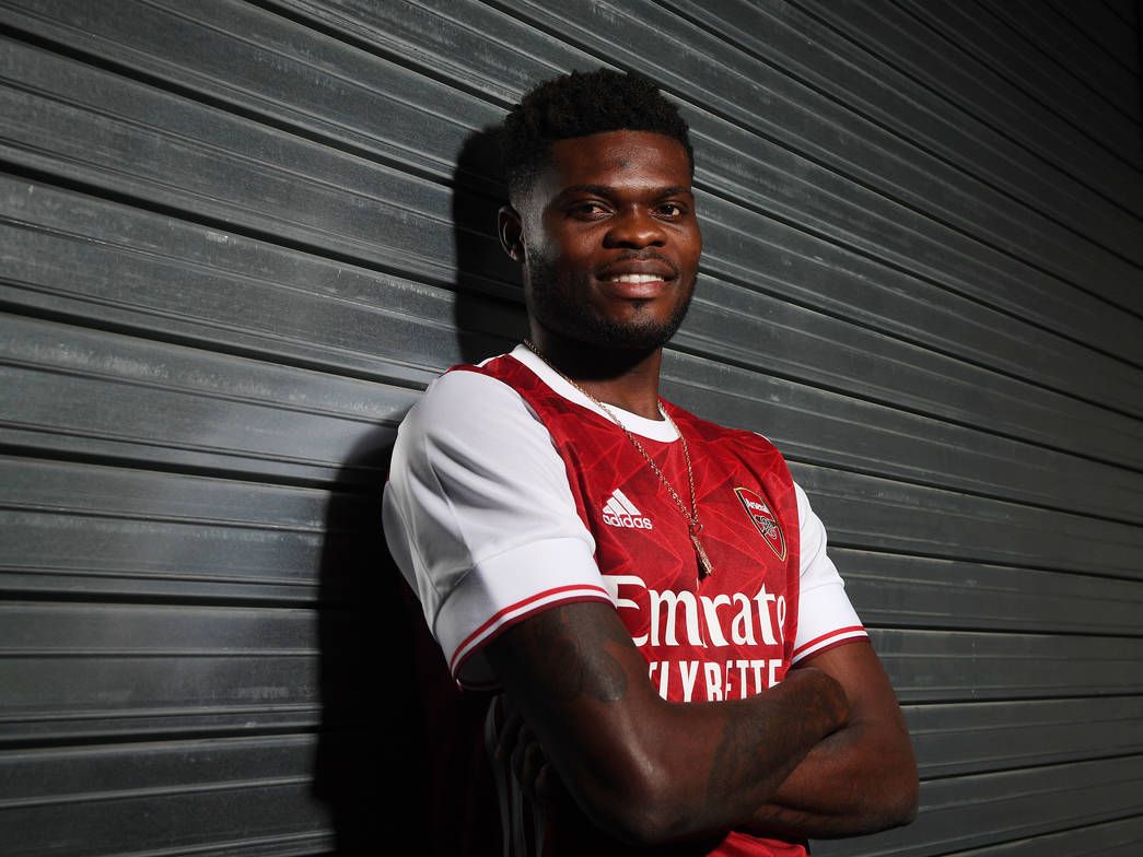 1045x784 Photos First pics of Thomas Partey posing in Arsenal kit following £45m move. Football Talk. Premier League News