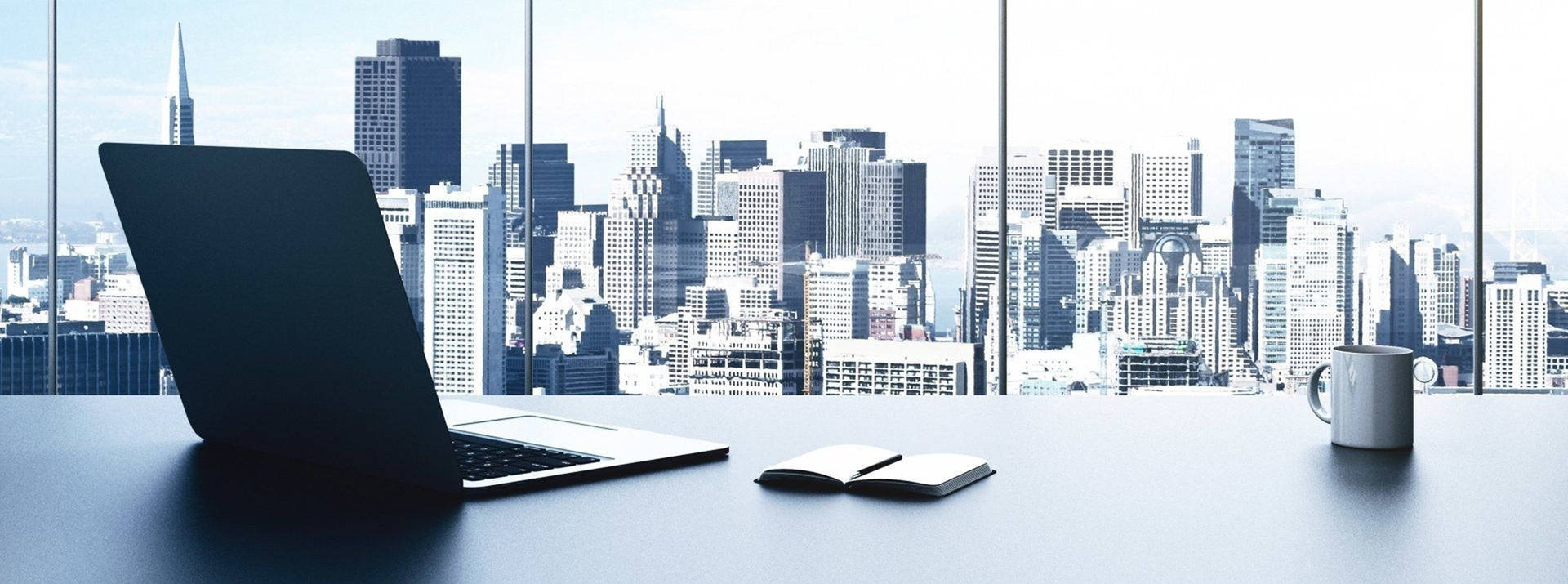 1920x715 Download Overlooking City View From An Office Desk Wallpaper