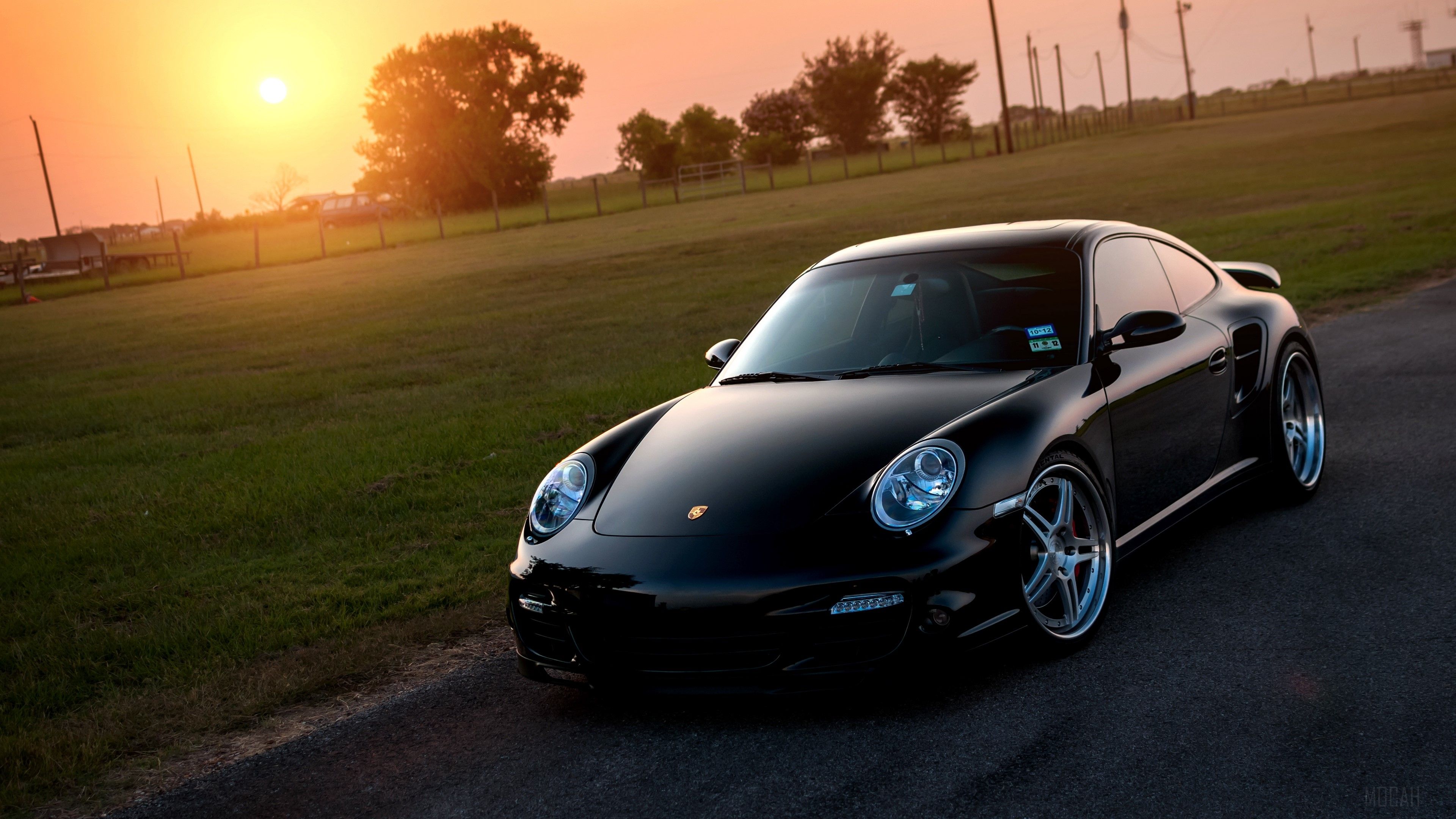 3840x2160 porsche, turbo, black, front, sun, grass, reflections 4k Gallery HD Wallpaper