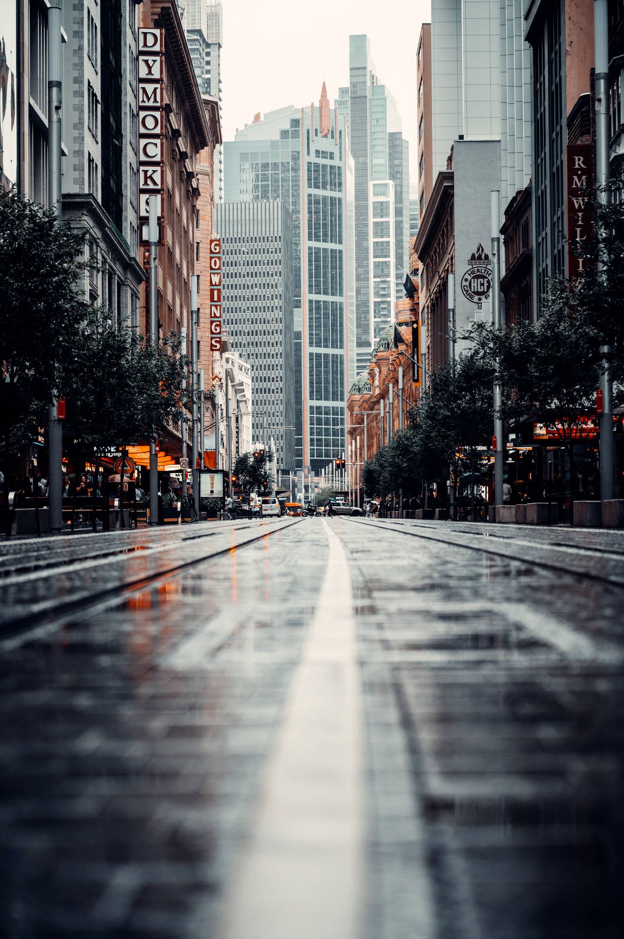 1277x1920 Download Wet Road In The City Wallpaper