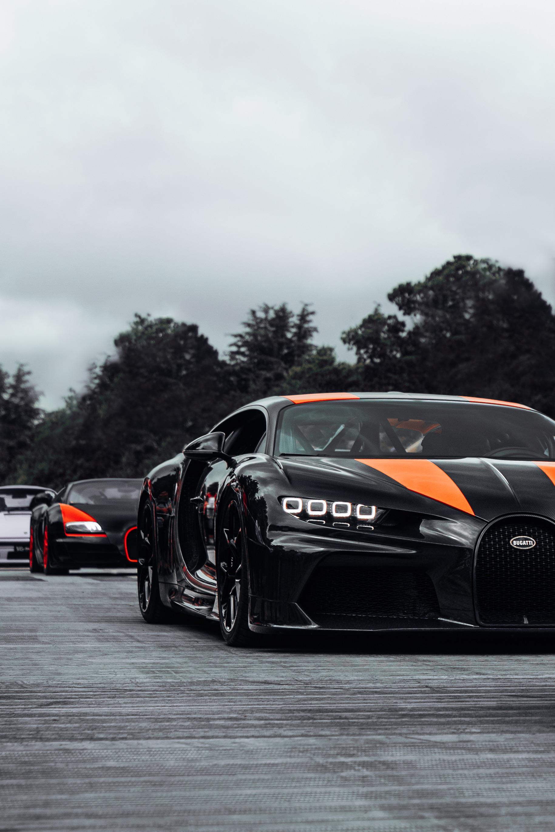 1829x2742 Bugatti Chiron Super Sport followed by a Bugatti Veyron Grand Sport Vitesse World Record Edition. (1829x2742)