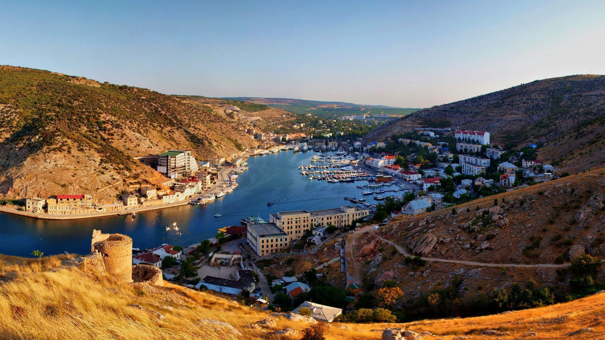 2048x1152 Download wallpaper 2048x1152 crimea, balaklava, river, boats, mountains ultrawide monitor HD background
