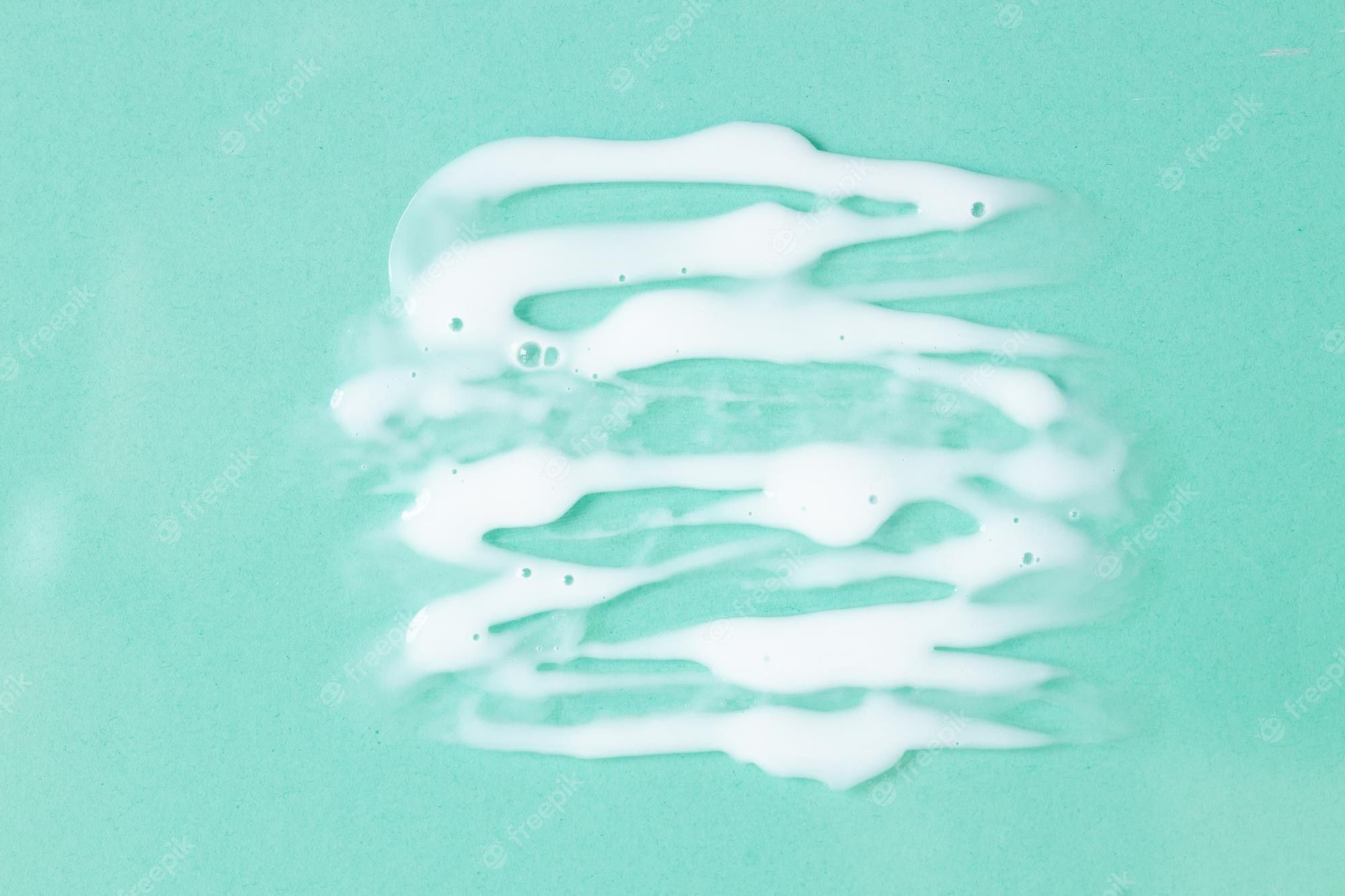 2000x1333 Premium Photo. Skincare cosmetic cream lotion swatch smear smudge on mint color background white creamy hygiene be
