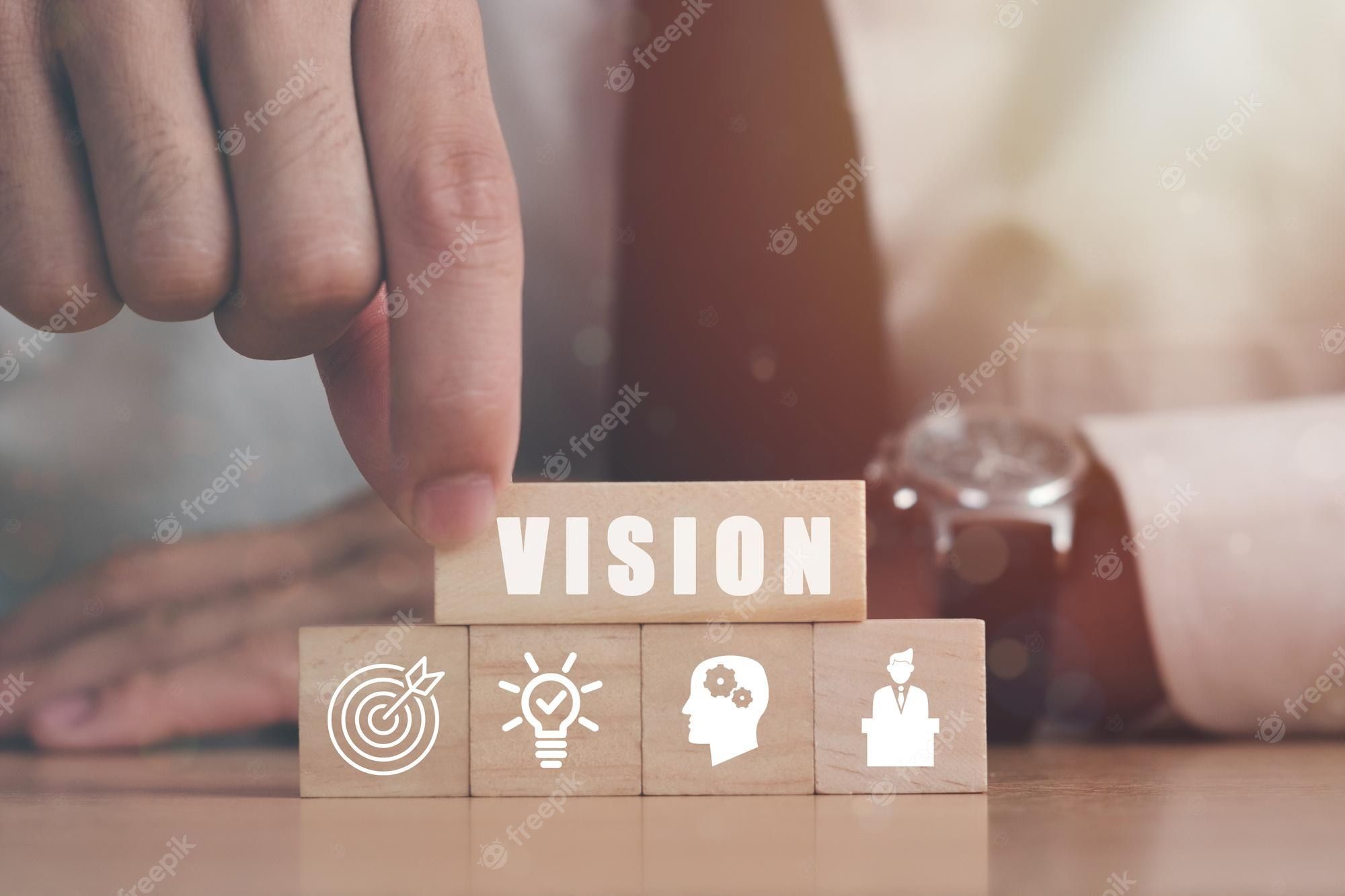 2000x1333 Premium Photo. Businessman hand holding wooden building blocks with icon leader business mission vision core value strategy concepts