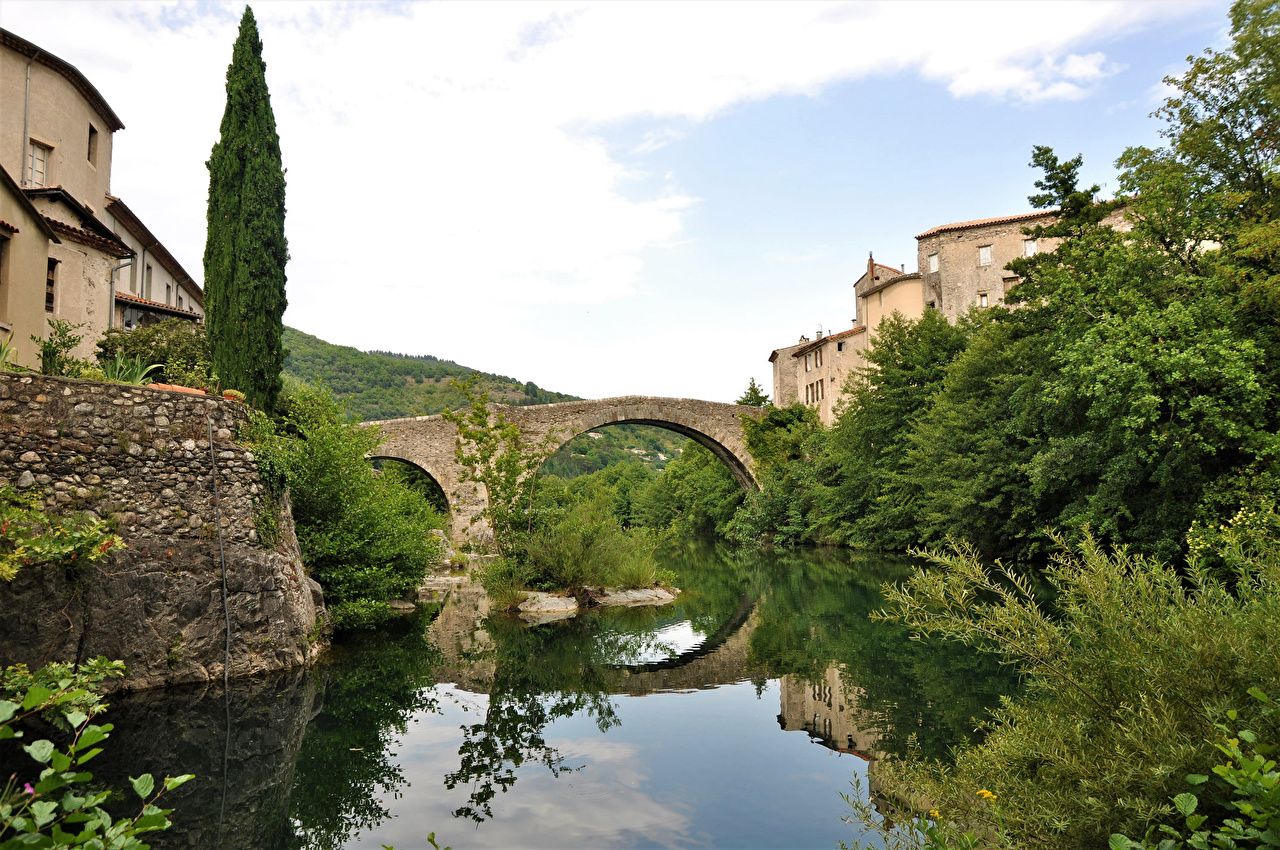 1280x850 Wallpaper France Le Vigan Cliff Bridges river Bush Houses Cities