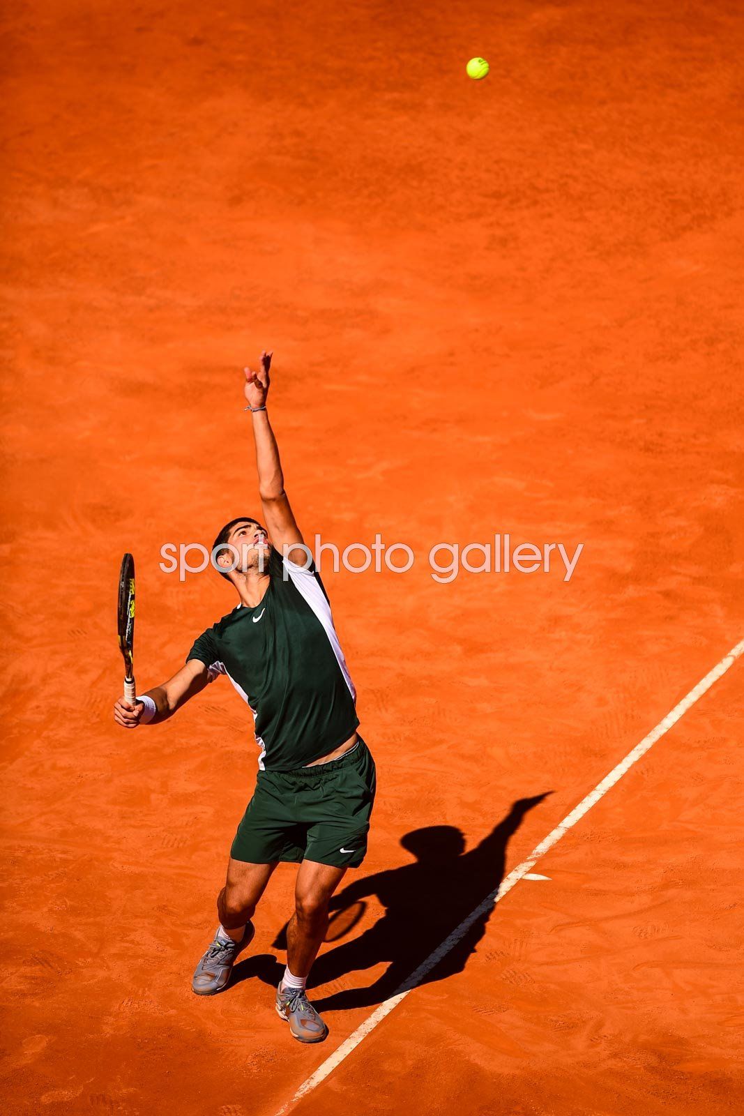 1067x1600 Carlos Alcaraz of Spain serves Madrid Open 2022 Image