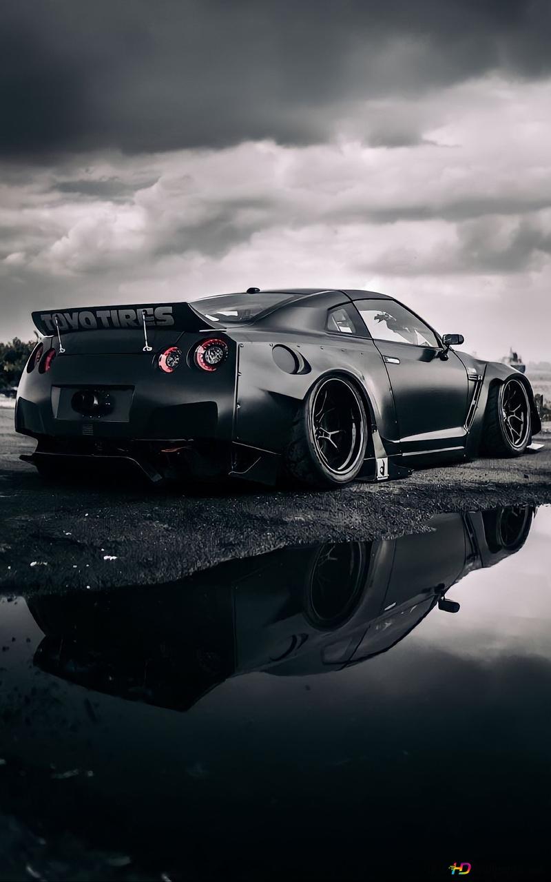 800x1280 Cool black glossy color Nissan reflecting in water on asphalt road in cloudy view outdoors HD wallpaper download
