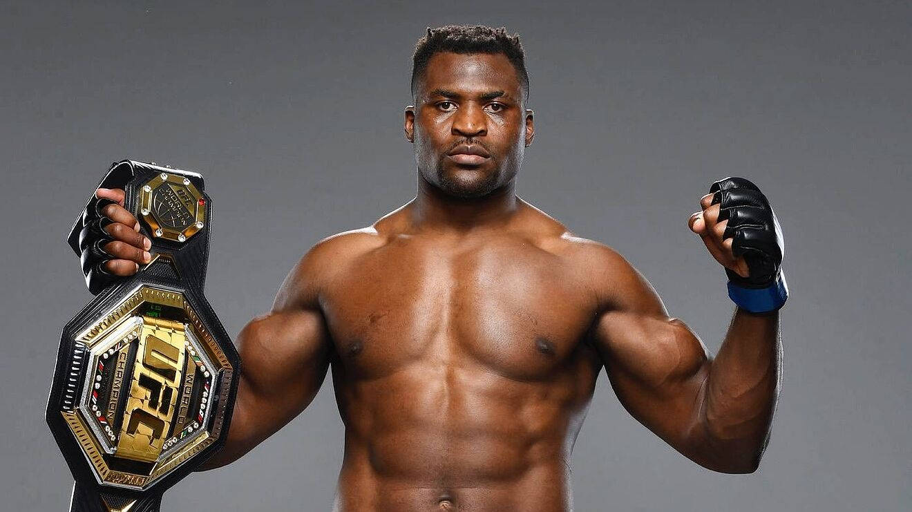 1320x741 Download Francis Ngannou Holding Championship Belt Wallpaper