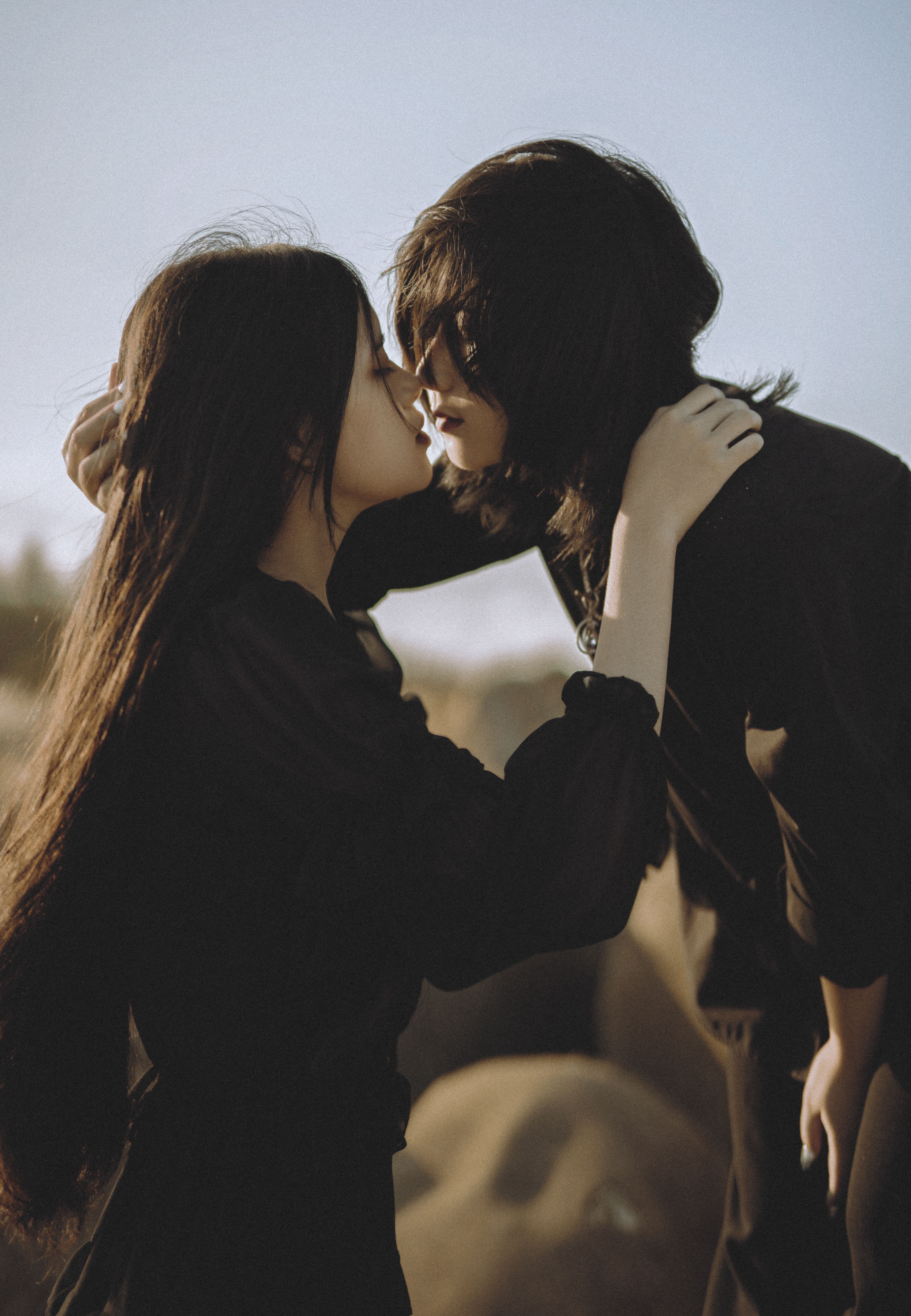 4000x5779 Lesbian Asian couple in moment of kiss outdoors · Free