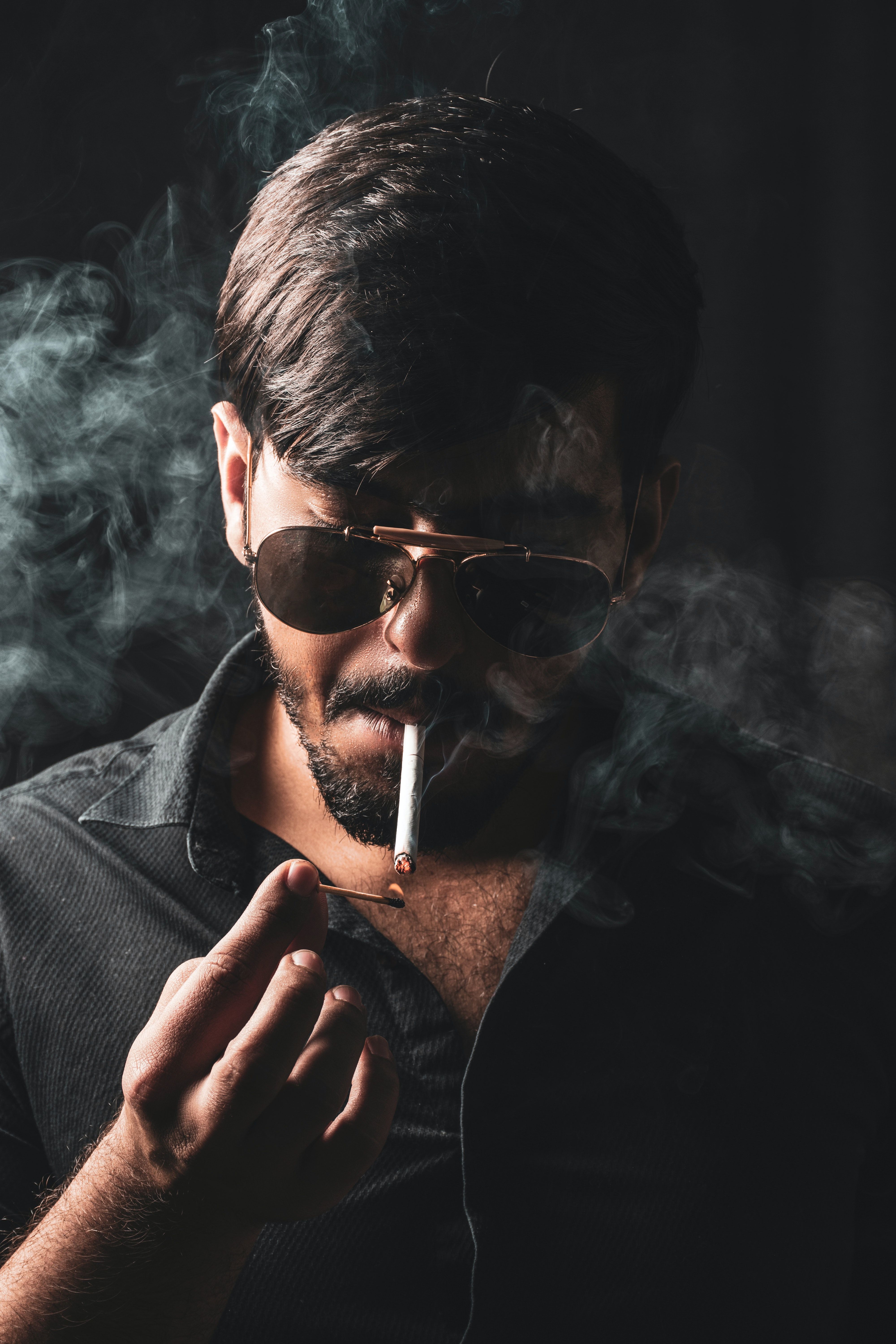 4000x6000 Selective Focus Photography Of Man Smoking Cigarette · Free
