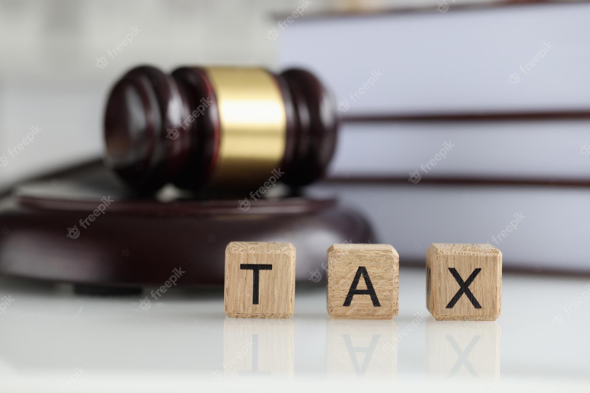 2000x1334 Premium Photo. Tax court financial crimes and investigations closeup paying state income tax concept