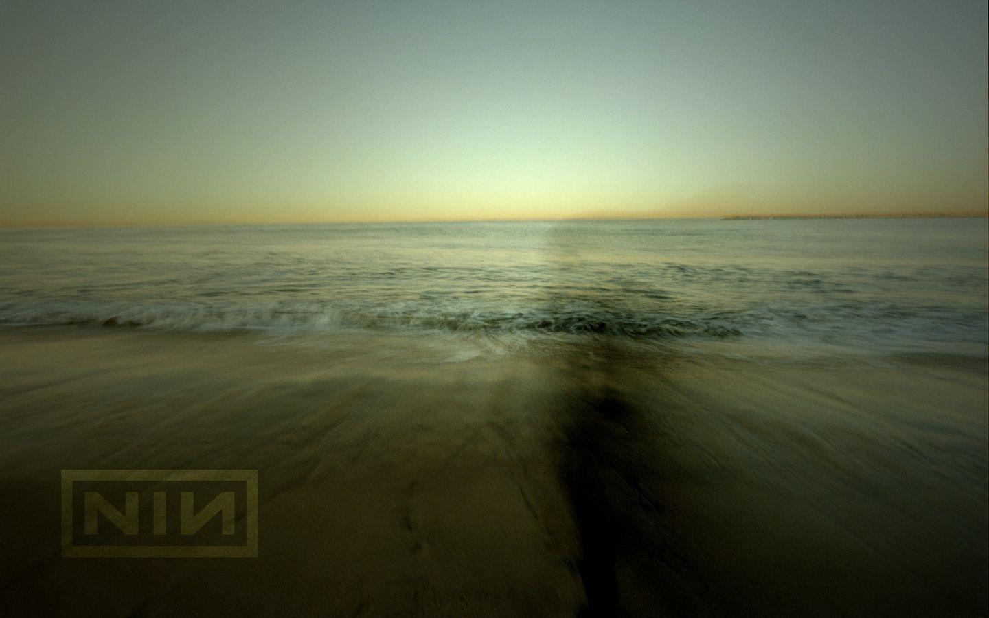 1440x900 Download wallpaper 1440x900 nine inch nails, sea, waves, coast, sign