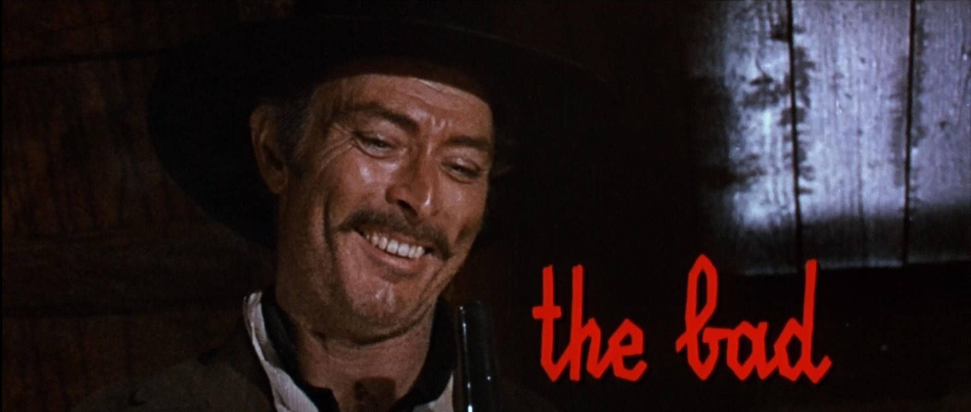 1920x815 Download Iconic portrait of legendary actor Lee Van Cleef in character as Angel Eyes Wallpaper
