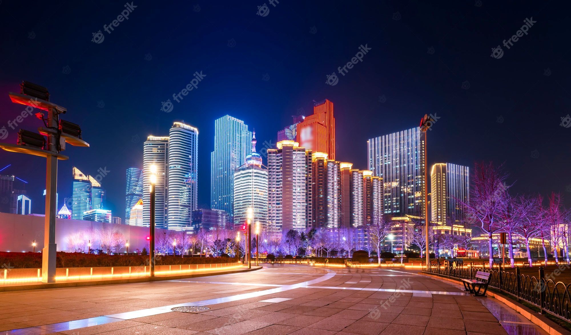 2000x1175 Premium Photo. Beautiful nightscape of urban architecture in qingdao