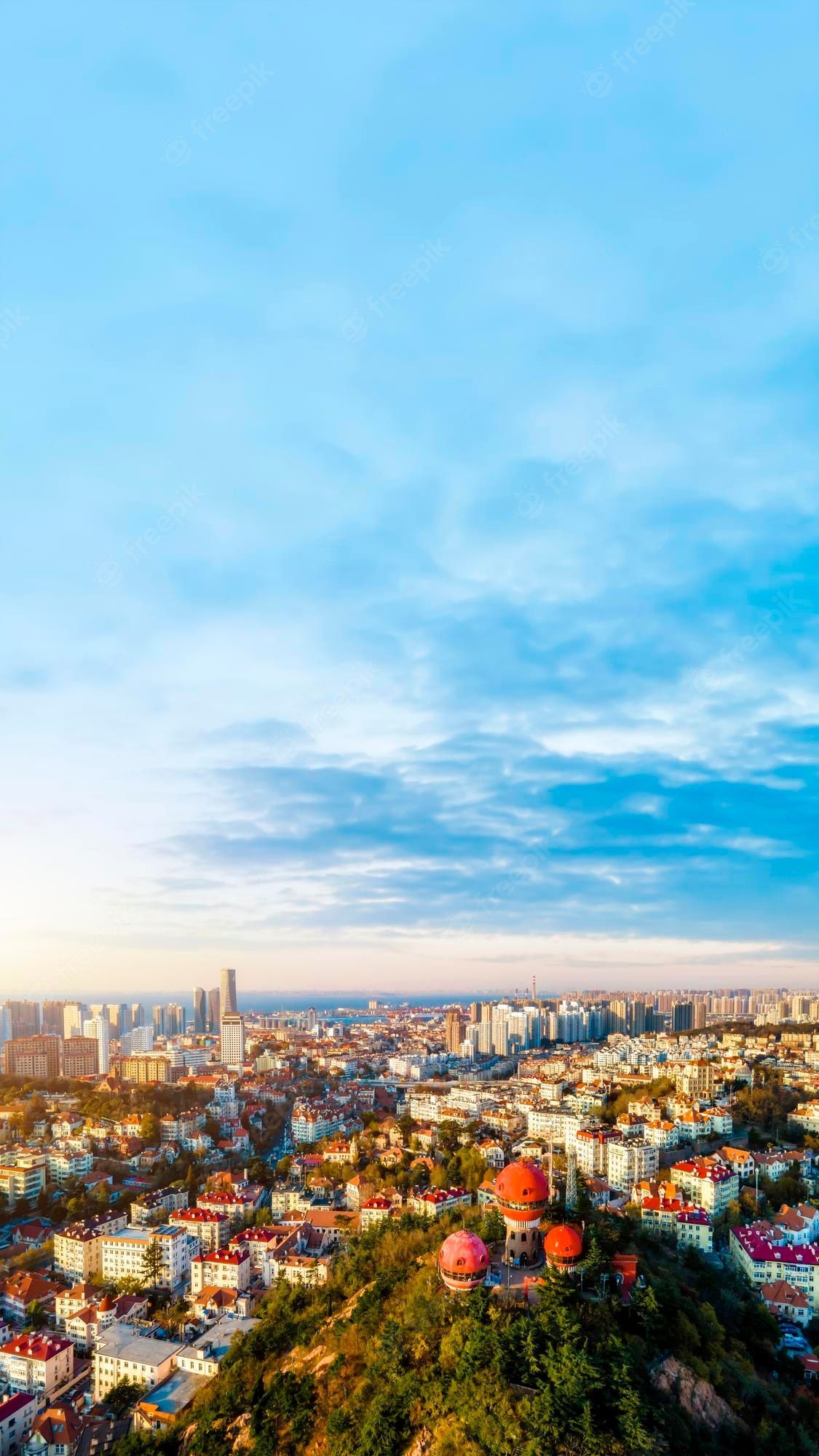 1125x2000 Premium Photo. Aerial photography of the coastline scenery of the old city of qingdao china