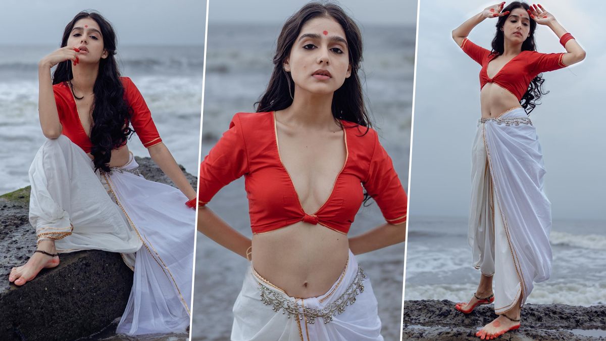 1200x675 Anaswara Rajan Poses Seductively in Red Blouse With Plunging Neckline and White Dhoti; Super Sharanya Actress Oozes Sexiness in Her Latest Photohoot (View Pics)