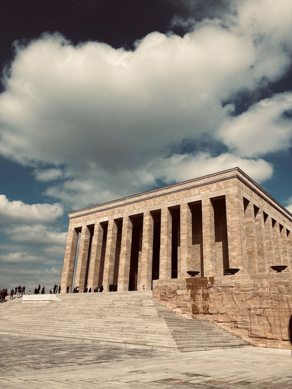 1000x1333 A large stone building with columns on the side of it photo