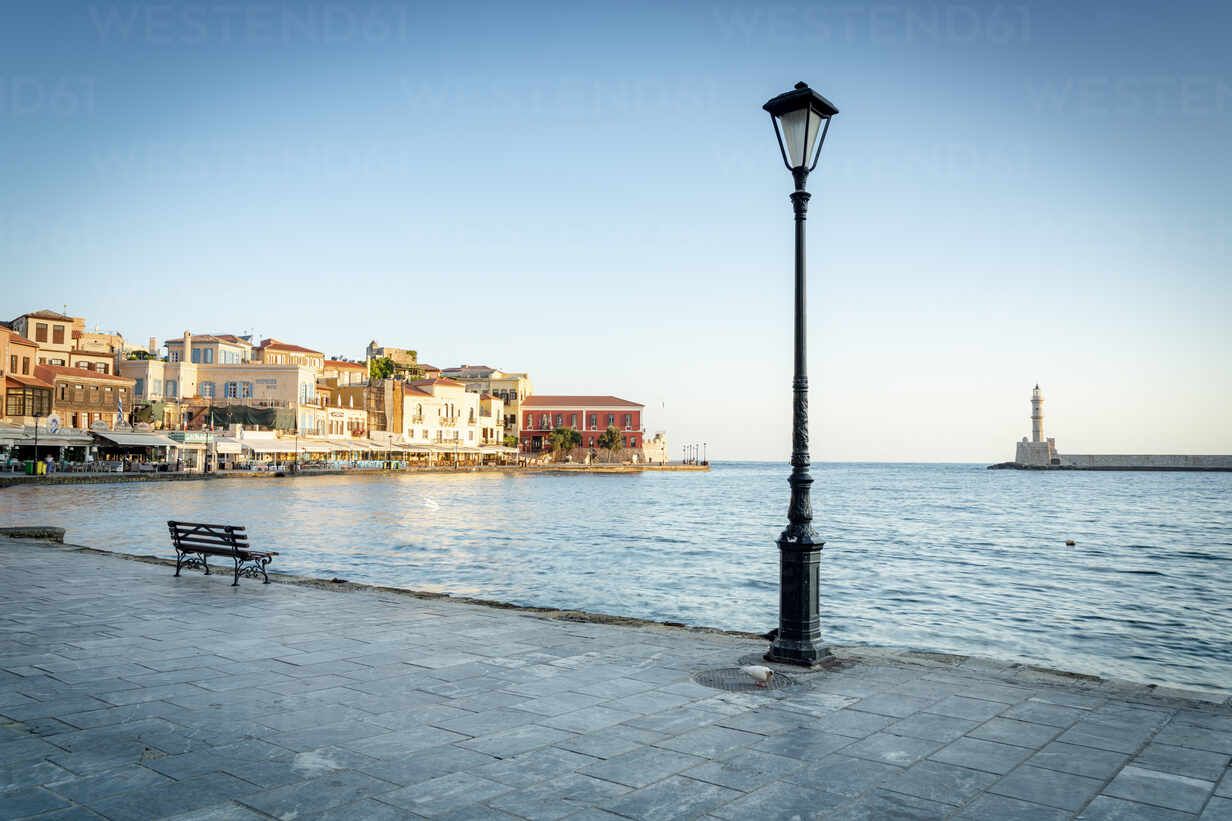 1232x821 Old lantern in the Venetian harbour of Chania with lighthouse in background, Crete, Greek Islands, Greece