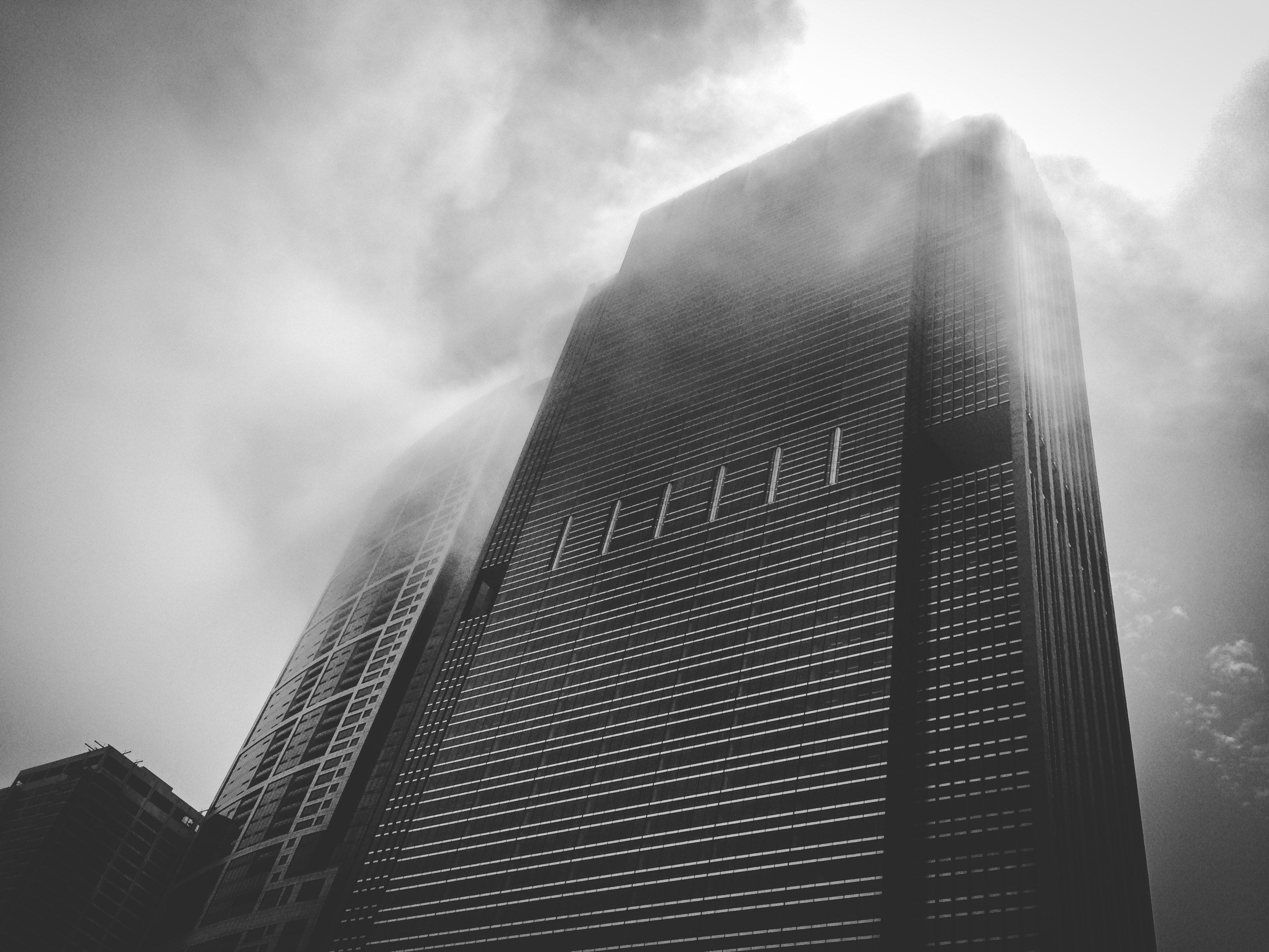 3264x2448 Wallpaper / a black skyscraper shrouded in mist on a cloudy day, ominous skyscraper 4k wallpaper free download