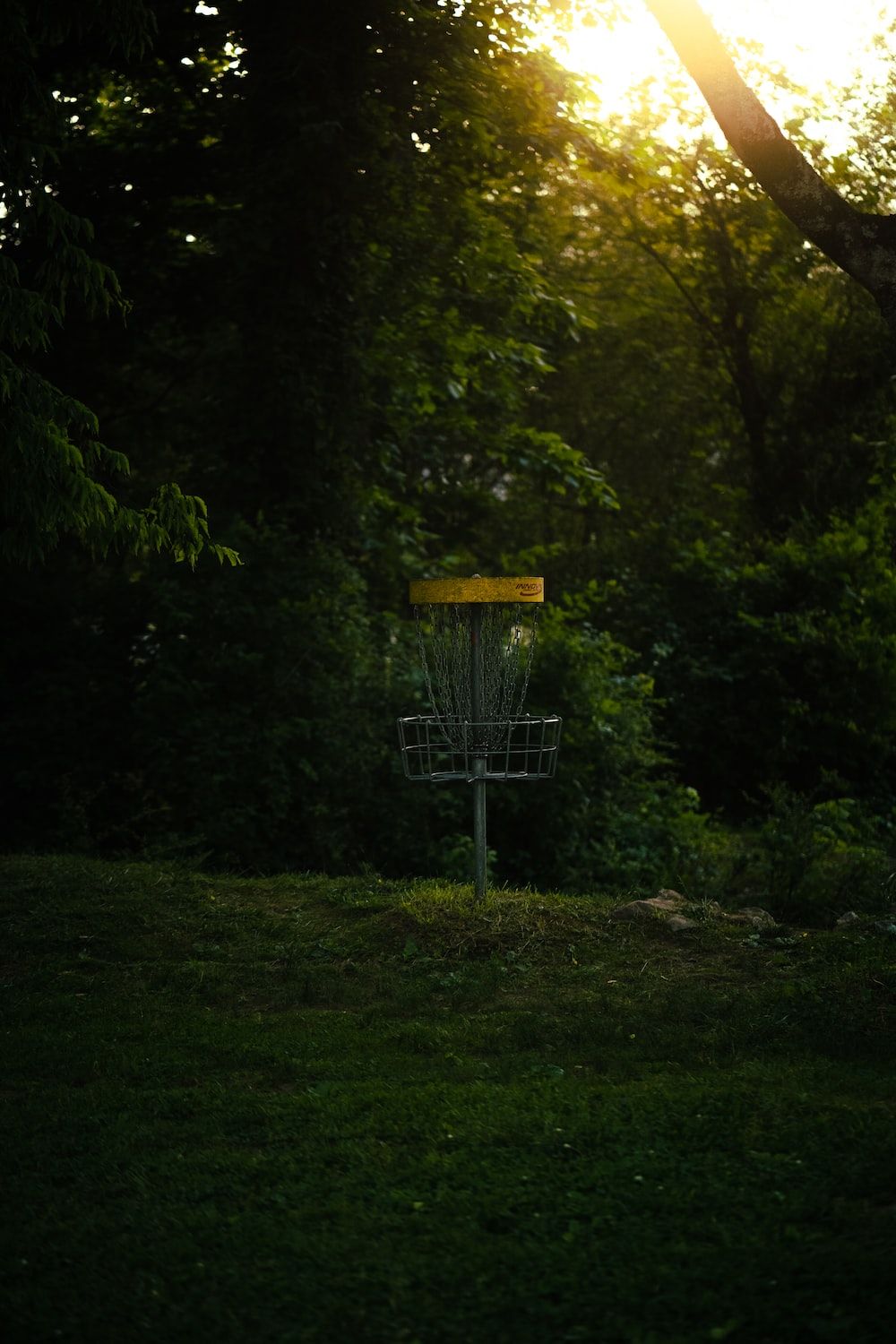 1000x1500 A frisbee golf goal in the middle of a field photo