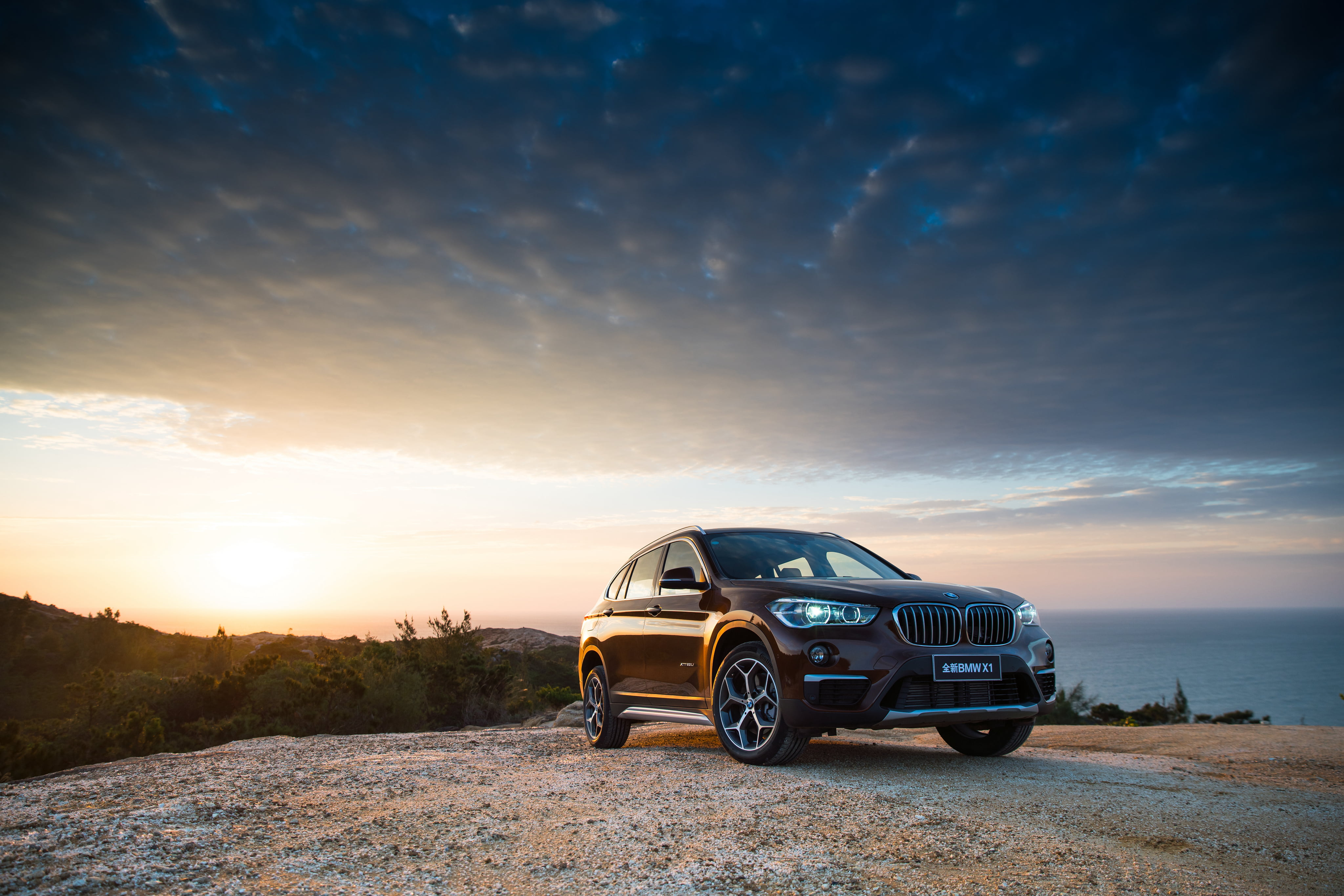 4096x2732 Black BMW X5 on mountain during golden hour HD wallpaper