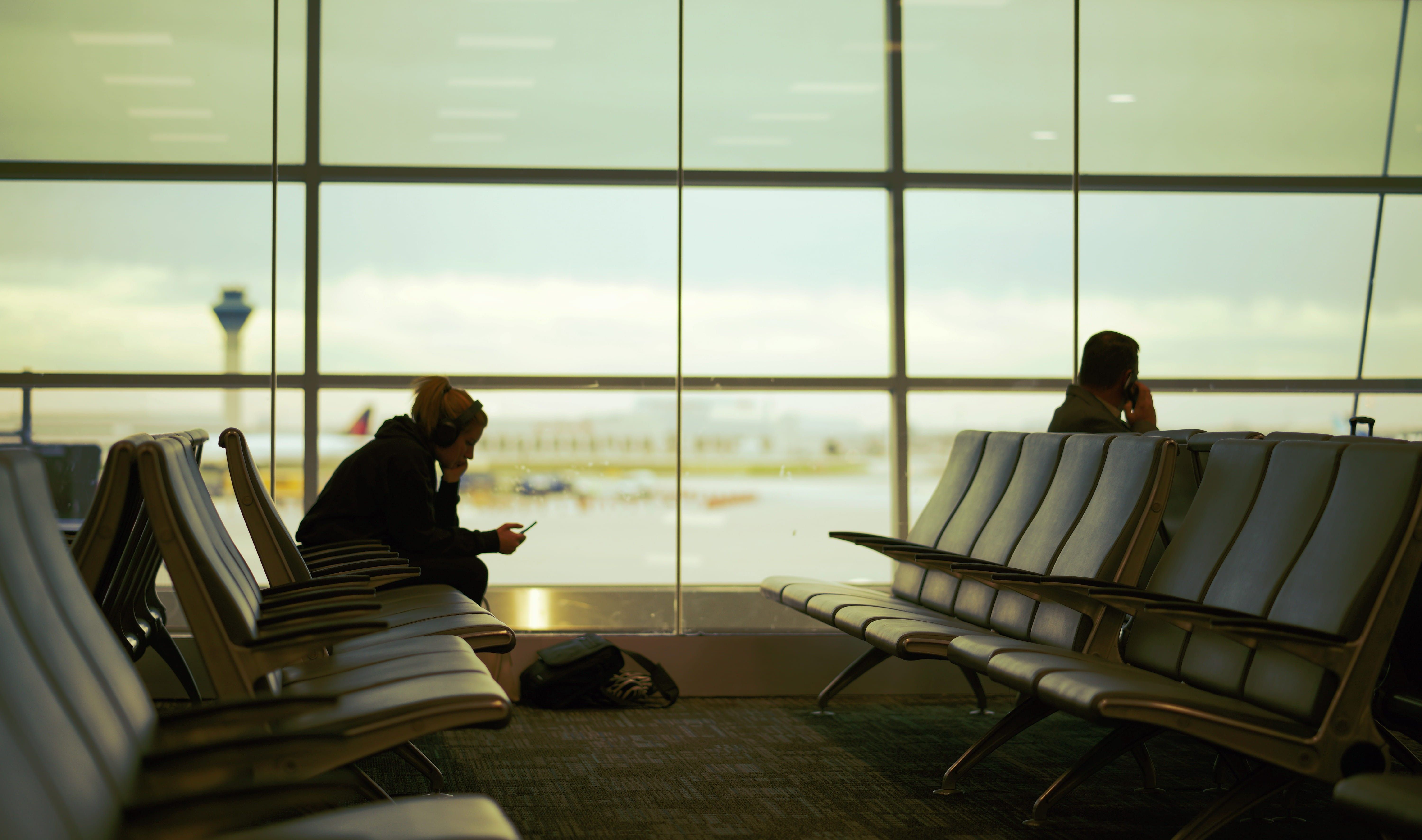 6000x3545 Wallpaper / relaxation, flying, toronto, waiting, human, seat, furniture, day, tourist, room, travel, chair, lifestyle, woman, airport terminal, airport, glass free download