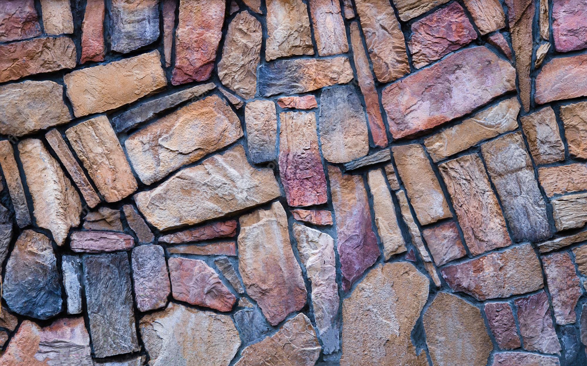 2000x1249 Premium Photo. The Wall Is Made Of Multi Colored Natural Stone, The Masonry Is Stone On Cement. Concept Wallpaper, Background And Decor